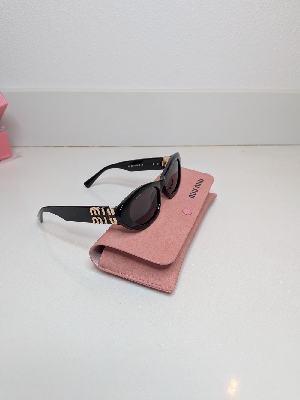 Miu Miu Women's Black Oval Cat Eye Sunglasses - Picture 6 of 13